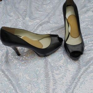 Black leather open toe pumps